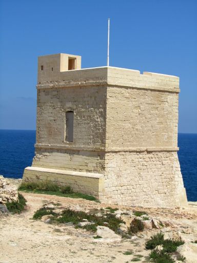 A Triq il-Wiesgha Tower or Mwejgel Tower, a 17th-century tower built by the Knights of the Order of St John to protect the coast of Xghajra, Malta.