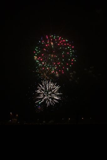 A vertical shot of the fireworks on the black background.