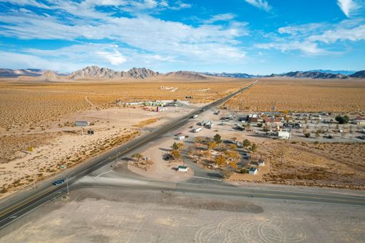 An aerial view of Amargosa Valley junction, with rest area, RV park, Amargosa Castle building and the Area 51 Alien Travel Center and Alien Cathouse