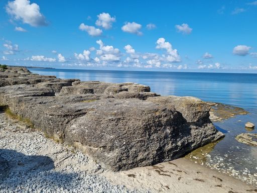 A beautiful shot of the shore under a blue cloudy sky in Oland, Sweden