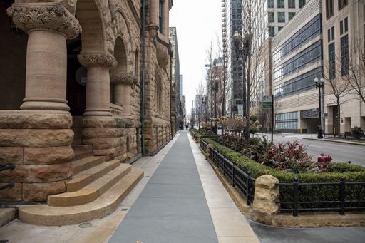 Streets of downtown Michigan ave are completely  empty  due the national health pandemic Covid-19. Business suffer as they are forced to close and boa