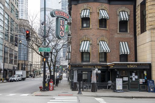Streets of downtown Chicago around State street and Michigan ave are completely desolated, empty  due the national health pandemic Covid-19