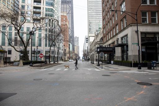 Streets of downtown Chicago around State street and Michigan ave are completely desolated, empty  due the national health pandemic Covid-19