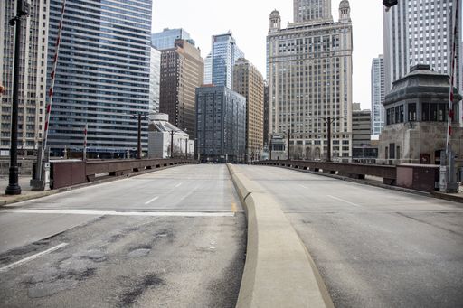 Streets of downtown Chicago around State street and Michigan ave are completely desolated, empty  due the national health pandemic Covid-19