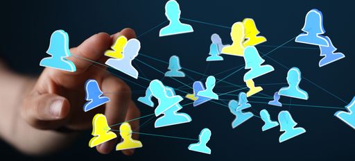 A 3D rendering of people silhouettes in the network team with a real person in the background - digital network concept