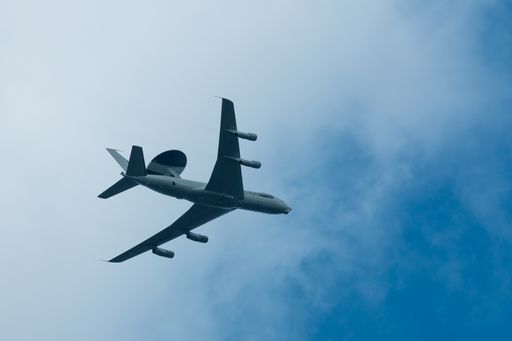 The Nato airborne warning and control systems aircraft high in the sky in Valkenburg, Netherlands