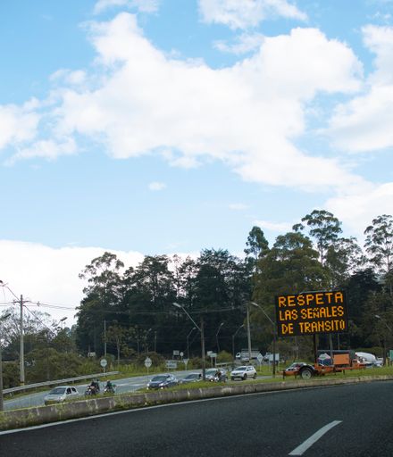 An English translation of "Respect transit signals" along the road in Caldas, Colombia