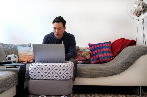 A closeup shot of a Caucasian male from Germany working from home