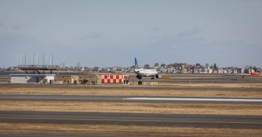United Airlines plane taxiing at Logan International Airport in Boston