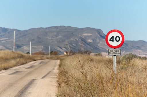 A street sign in southern Spain on a blurred mountainous background