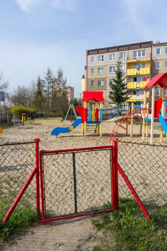 A vertical shot of an entrance gate to a playground