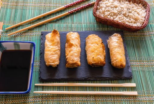 A top shot of the Vietnamese Nem Ran fried delicious crispy spring rolls on a blue plate