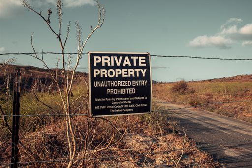 A private property sign in the dry hills of Irvine, California, USA