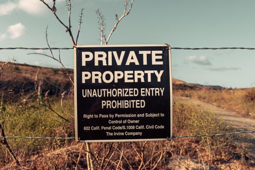 A private property sign in the dry hills of Irvine, California, USA