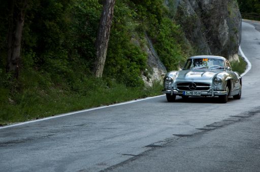 An elegant Mercedes 300 SL vintage car in a race, Cagli, Italy