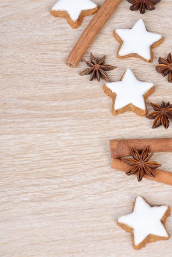 Cinnamon stars, traditional german christmas cookies, gingerbread, empty copy space, wooden background, greeting card
