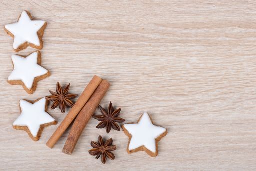 Cinnamon stars, traditional german christmas cookies, gingerbread, empty copy space, wooden background, greeting card