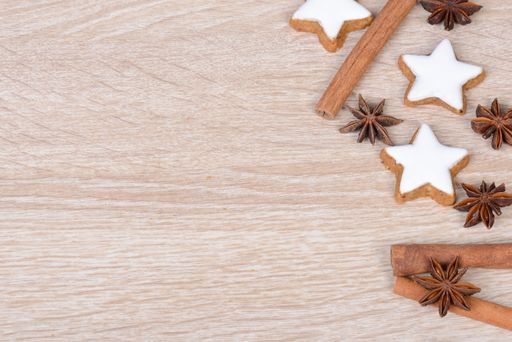 Cinnamon stars, traditional german christmas cookies, gingerbread, empty copy space, wooden background, greeting card