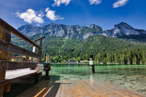A beautiful shot of a calm lake on high hills background in Hintersee Ramsau, Germany