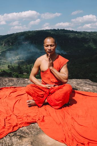 Buddhist monks meditating on a mountain in Cambodia