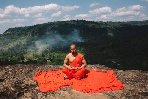 Buddhist monks meditating on a mountain in Cambodia
