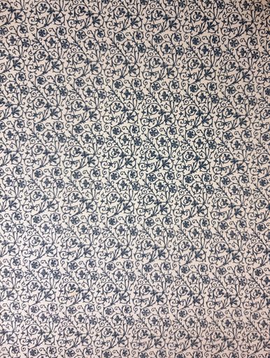 An intricate floral pattern in blue and white, showcasing detailed vine and flower motifs.