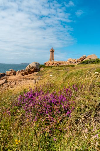 A vertical shot of a Mean Ruz Lighthouse in Perros-Guirec in Britany, Northwest France