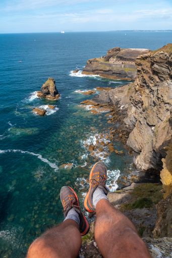 A vertical shot of a rocky islet with a war fort Fort des Capucins in Roscanvel, Crozon, France