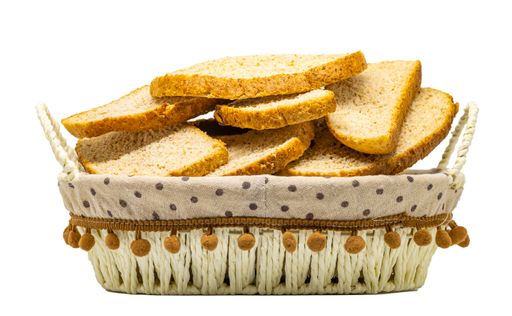 A basket filled with wholemeal bread isolated on a white background