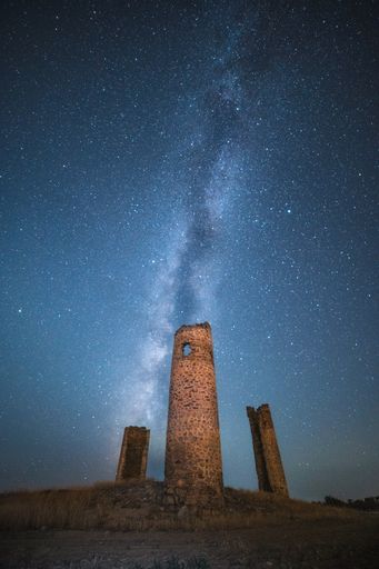 A vertical shot of the Milky way over the Castillo de Galvez in Toledo, Spain