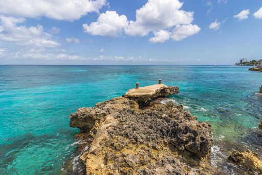 The view of the sea from the rocky shore. Cozumel, Quintana Roo, Mexico.