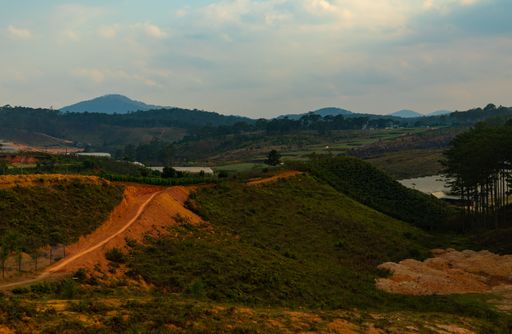 A road up the hill under a cloudy sky in Dalat