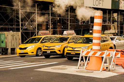 A view of yellow New York Cabs waiting at a traffic light in New York City, United States