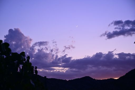 A closeup shot of an incredible sky view during the sunset with beautiful purple clouds