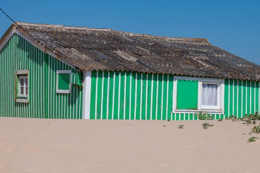 A blue-colored house on the shore of Caparica, Portugal