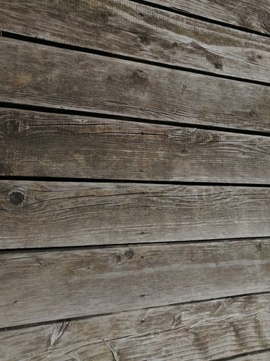 A vertical shot of wooden plank board texture