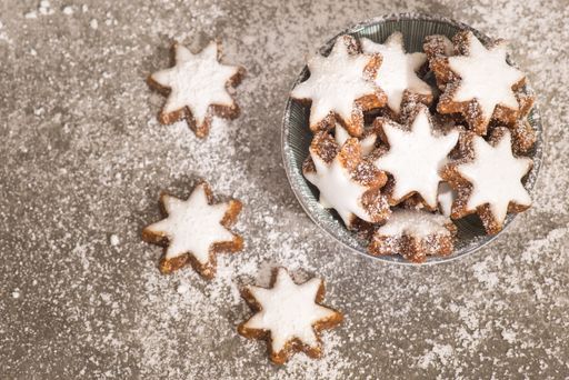 Cinnamon stars, traditional german christmas cookies, gingerbread, empty copy space, textured background