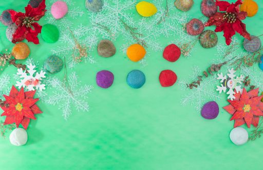 Green color background of christmas decoration with copy space for text or inscription.