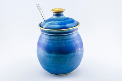 A horizontal shot of a sugar bowl in three different position with white background.