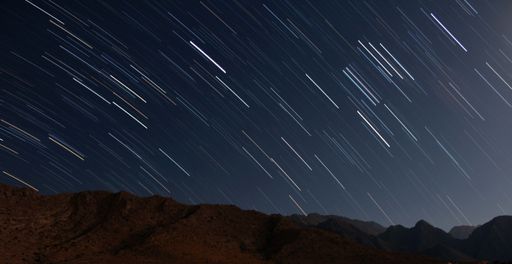The meteor shower at the night sky - perfect for background