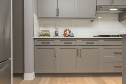 A beautiful shot of a modern house kitchen shelves and drawers
