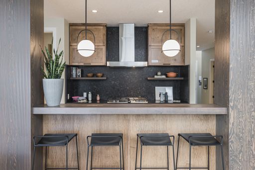 A beautiful shot of a modern house kitchen and dining room