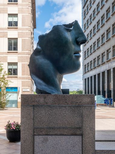 A vertical shot of a sculpture of Centurione I by Igor Mitoraj in Columbus Courtyard, Canary Wharf, London, UK