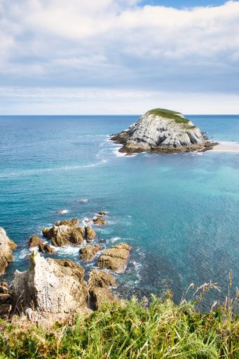 A vertical shot of a beautiful coast in the north of Spain, a province of Santander