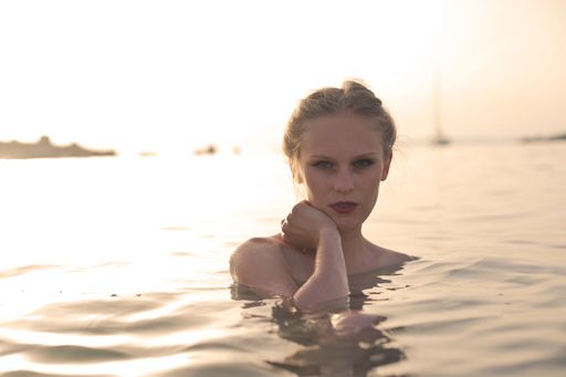 A portrait of an attractive Ukrainian woman in the sea on a sunny day