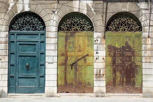 A closeup of rusty doors in Venice, Italy