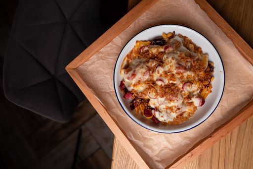 A top view shot of a tasty breakfast with yogurt and dry fruits