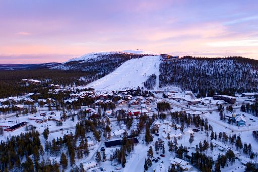 Aerial drone view of the Levi ski village, winter evening sunset, in Lapland