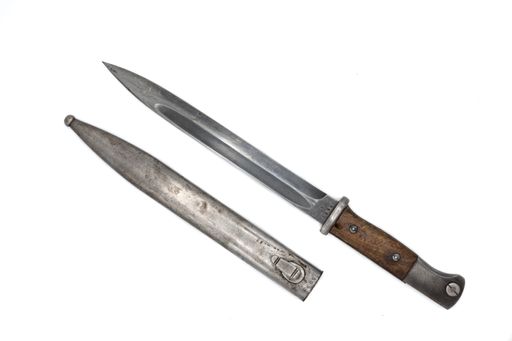 A closeup shot of a bayonet knife to mount on the WWII rifle on a white background