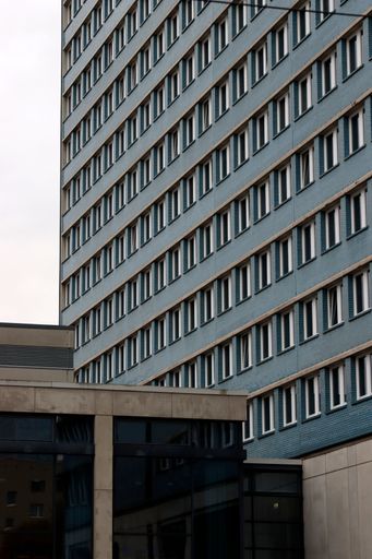 A modern building in Berlin with blue facade and white-framed windows